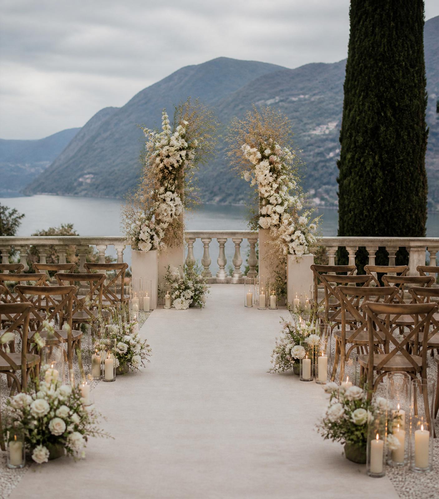 Minimal outdoor wedding ceremony with neutral florals and candlelight